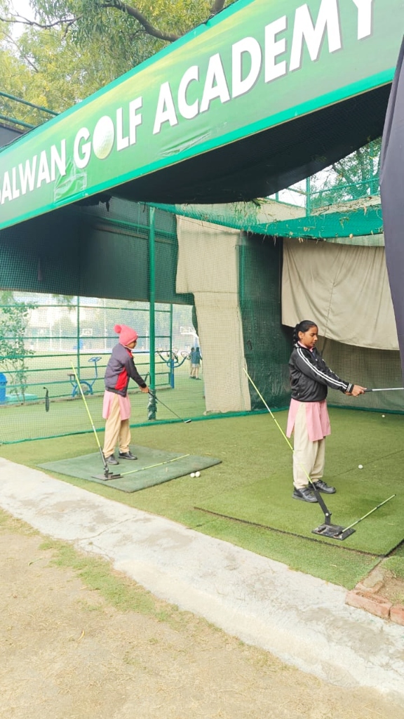 Students practicing golf swing at Salwan Golf Academy