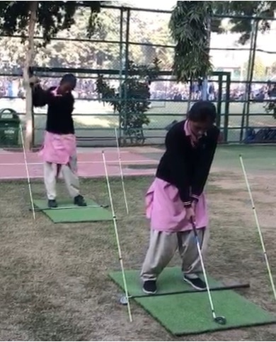 Magic Bus girls practising the swing